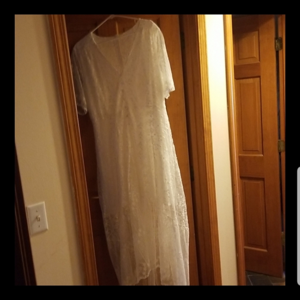 White lace button down dress. I was going to wear it to get married in